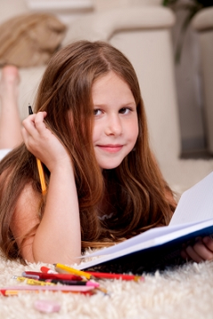 A Girl Doing Homework by photostock A Girl Doing Homework by photostock